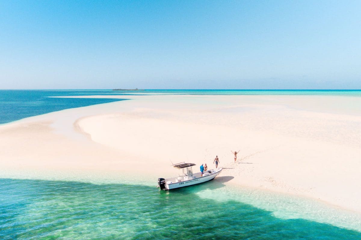 Hopping around sandy island outcrops by boat - Bahamas Tourism Centre