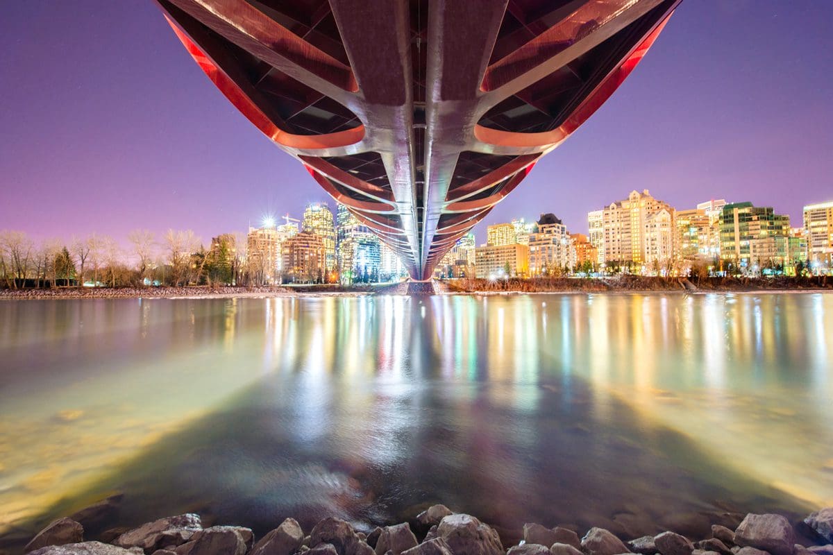 Bow River and Downtown Calgary viewed from underneath Peace Bridge - Youn Park
