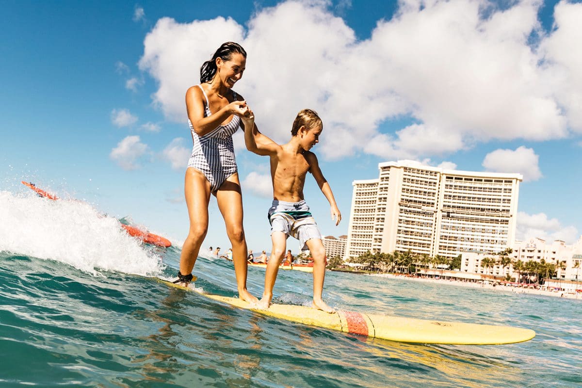 Catching a wave to the shore in Waikiki - Hawaii Tourism Authority