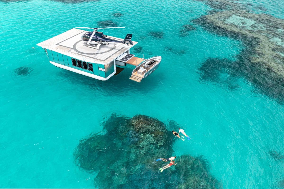 Snorkelling by a heliport in the Whitsundays, Queensland - Tourism Australia