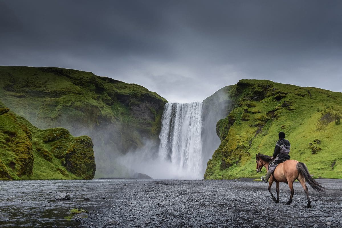 Horse riding at Skogafoss Waterfall, Iceland