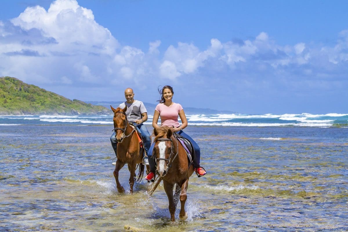 Enjoying a horseback adventure - Visit Barbados