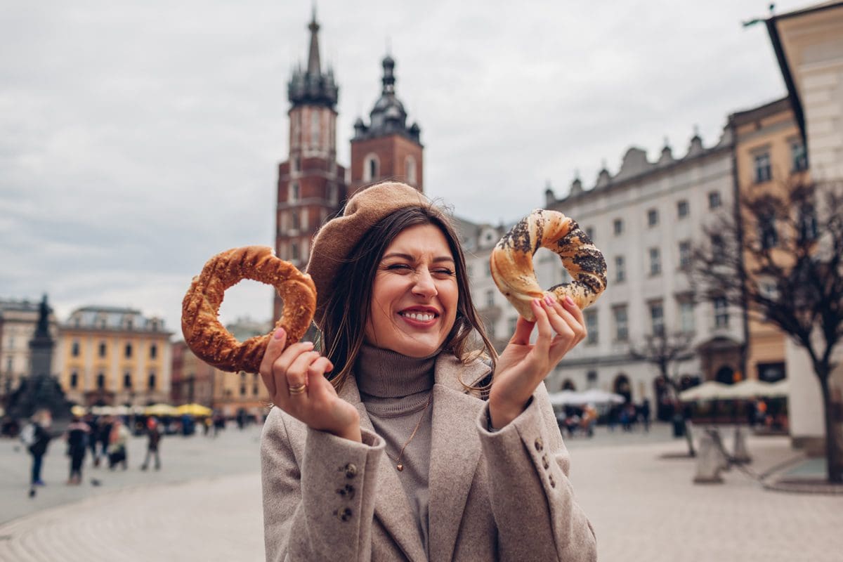Krakow tourist with traditional obwarzankek bagels