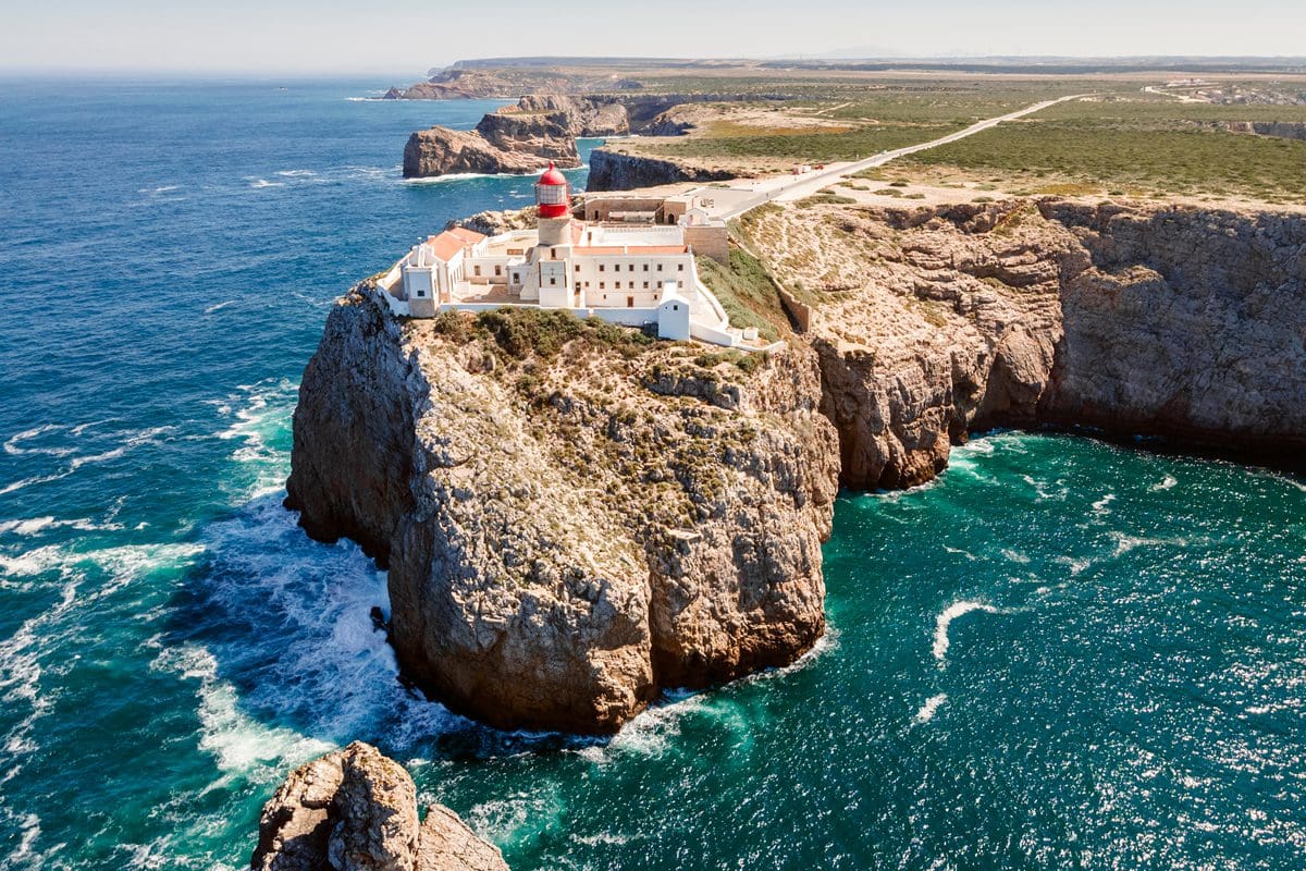 Lighthouse on the high cliffs of Saint Vincent Cape in Sagres, Algarve