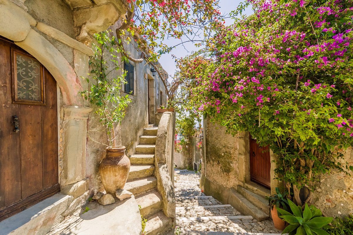 Old cobbled lane village scene in Sicily, Italy