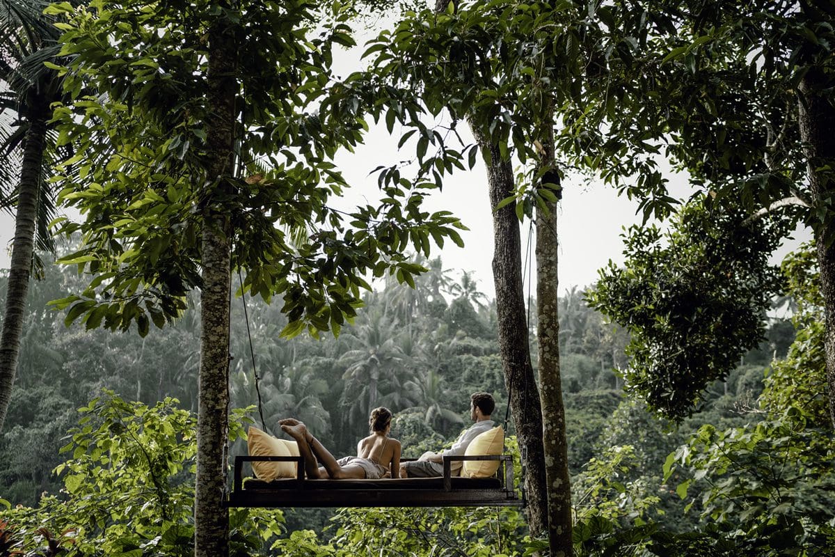 Couple relaxing in the lush landscape of Ubud, Bali - Indonesia Tourism/Fikry Auliya Rahman