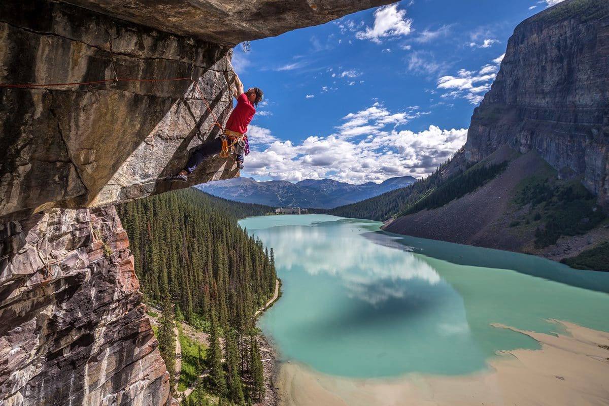 Rock climbing with Fairmont Lake Louise in the background - John Price