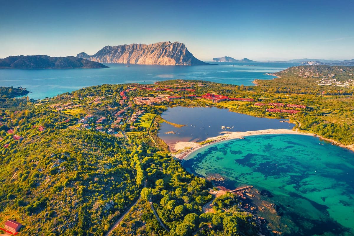 Salina Bamba Beach and Tavolara Mountain in Sardinia, Italy