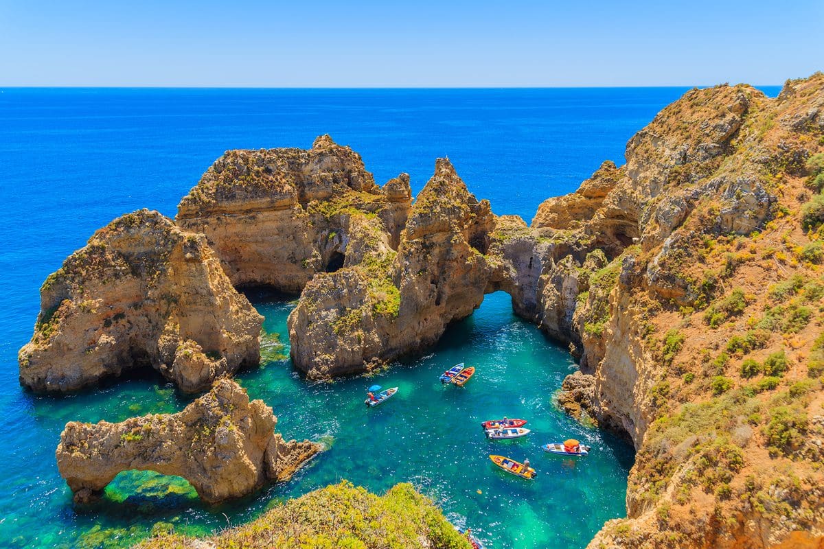 Small boats on the water of Ponta de Piedada, Algarve
