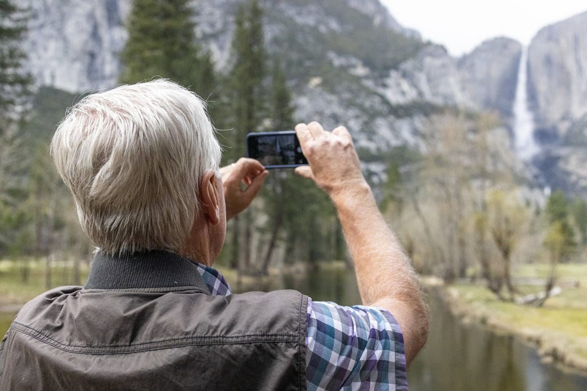 Taking photos in Yosemite - Visit California/Getty Images