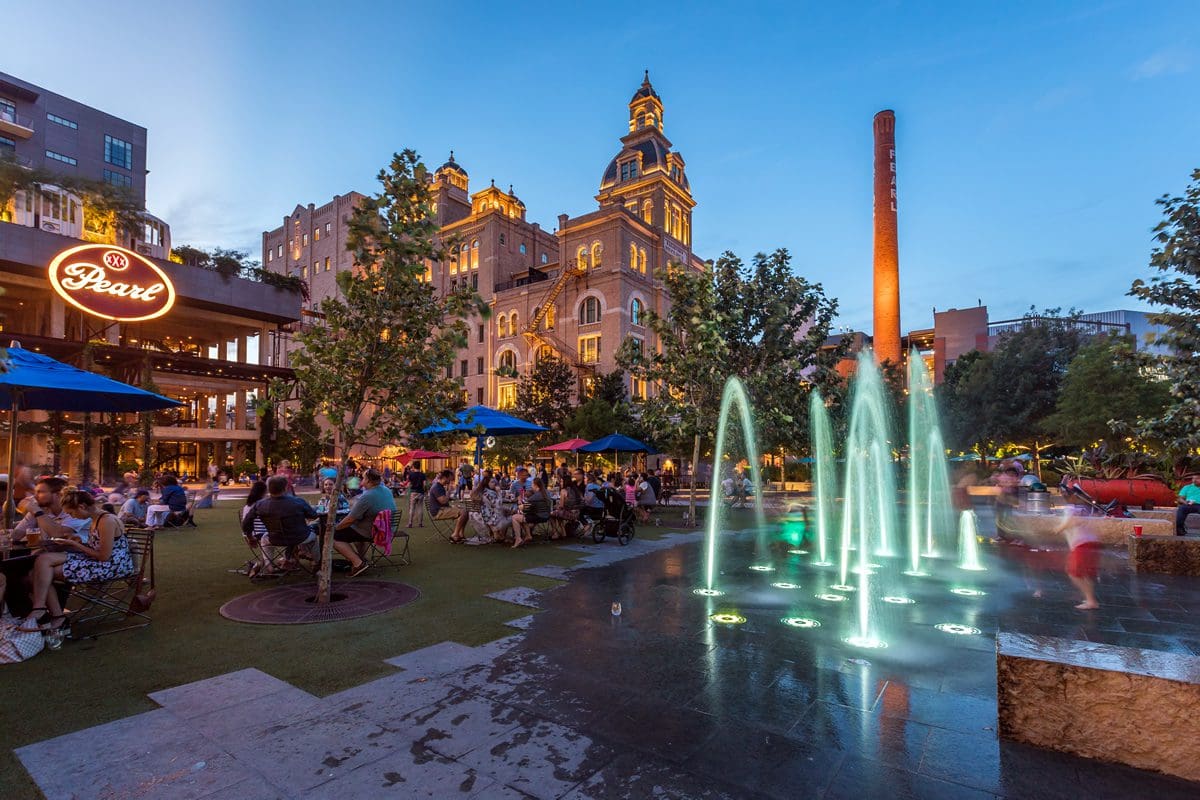 The historic Pearl fountain and lawn in the evening, San Antonio - Travel Texas/Pierce Ingram