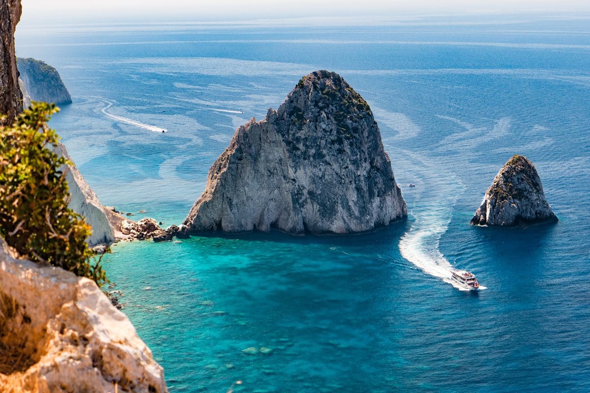 View of boat navigating rocks in Zakynthos