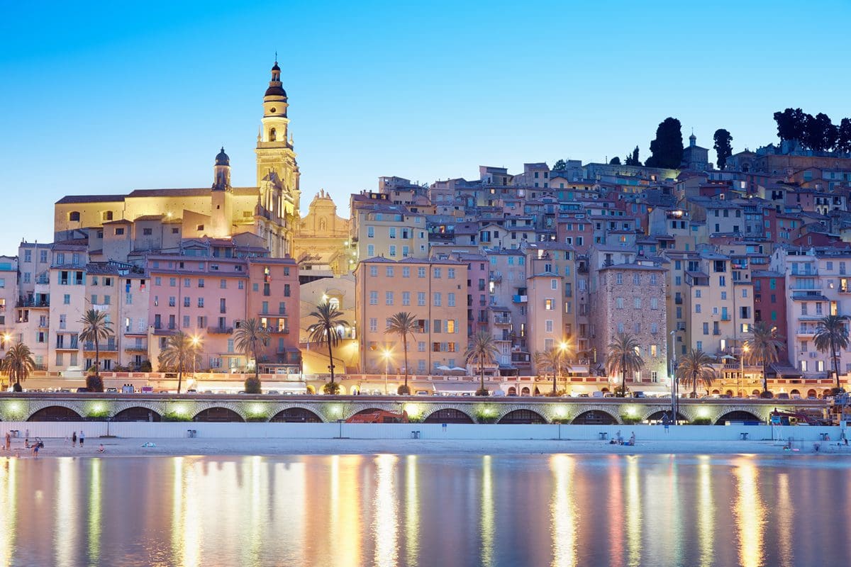 Old city of Menton on the French Riviera illuminated in the evening