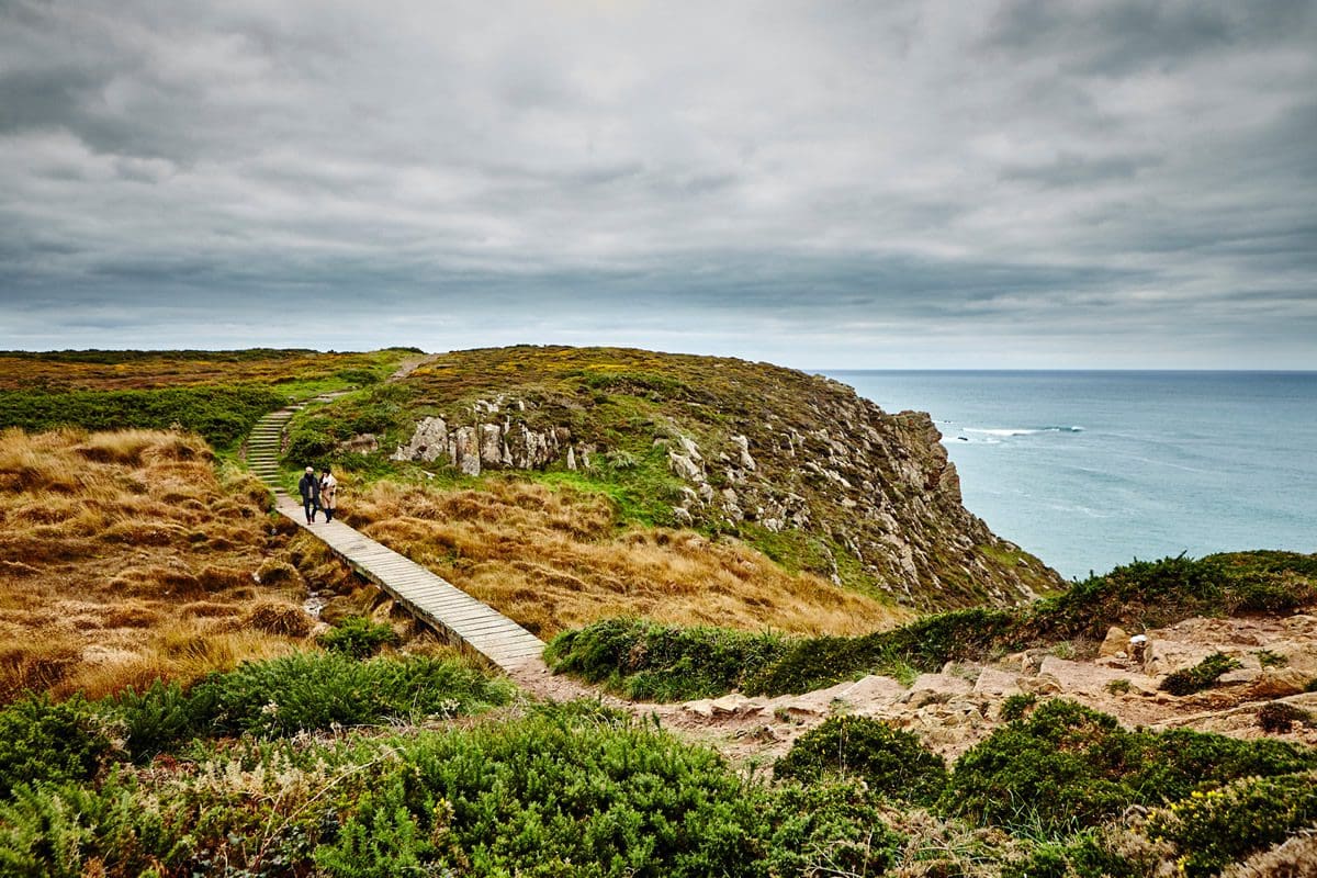Couple coastal walking - Visit Jersey