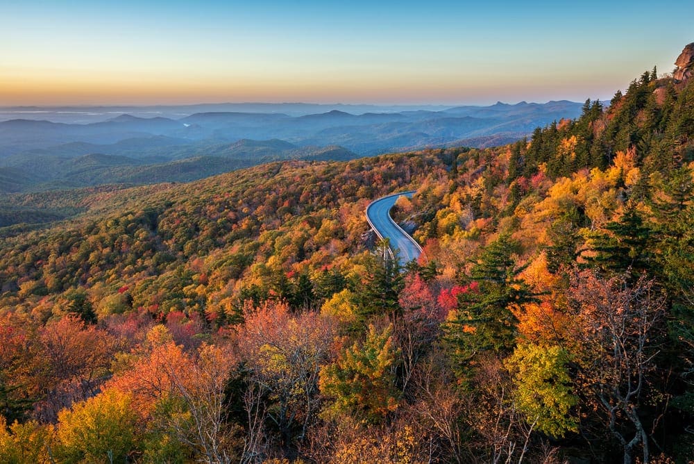 Lynn Cove Viaduct snakes along the side of Grandfather Mountains along the Blue Ridge Parkway in North Carolina. Holidays to North Carolina