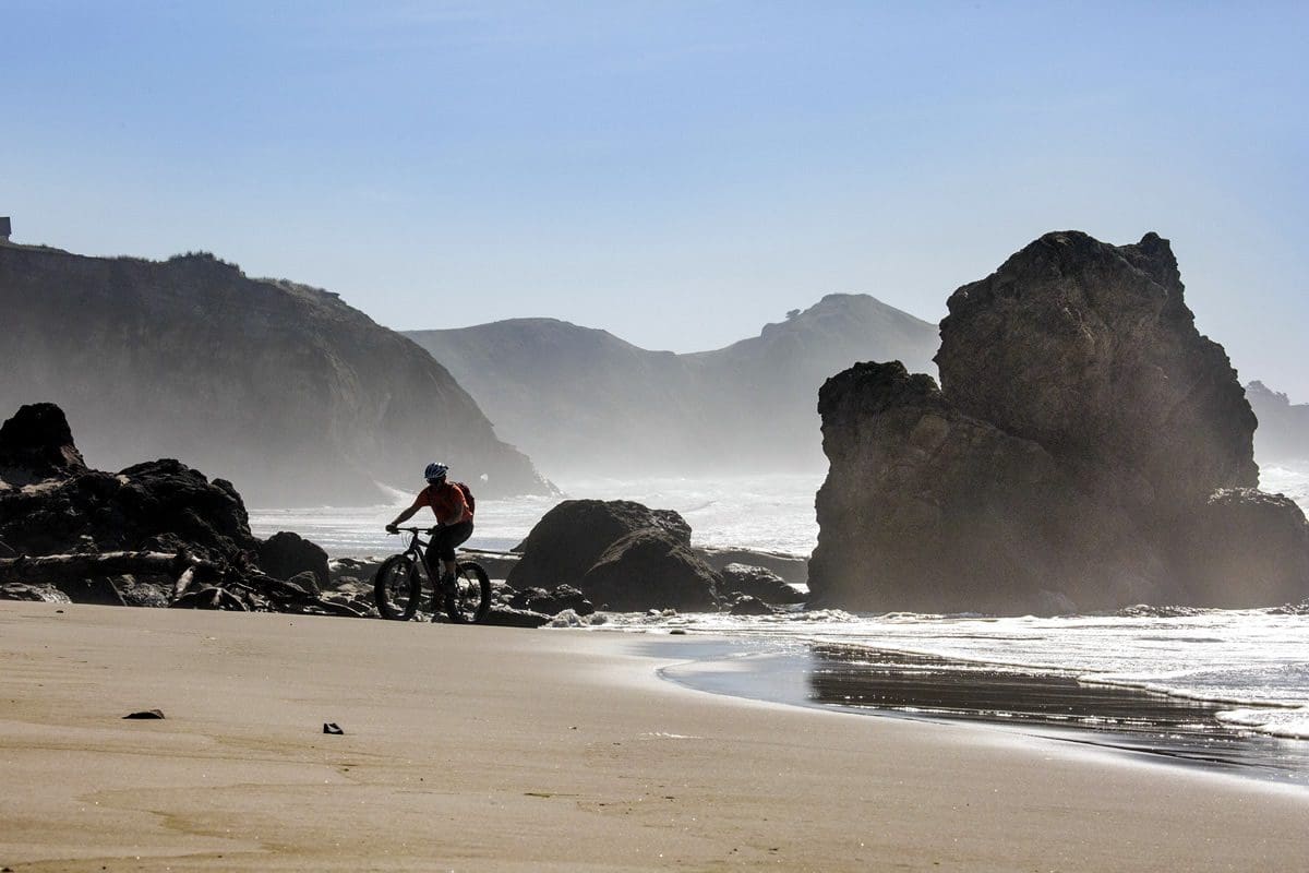 Fat biking by Otter Rock in Newport - Travel Oregon