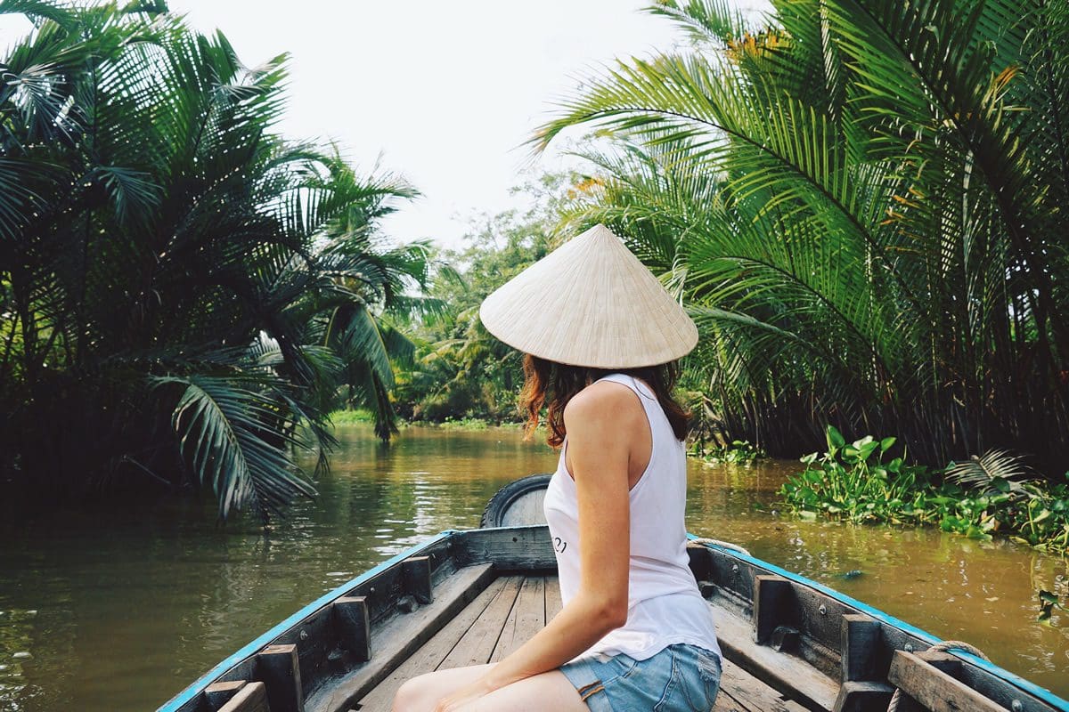 Woman taking a river tour of the Mekong, Vietnam