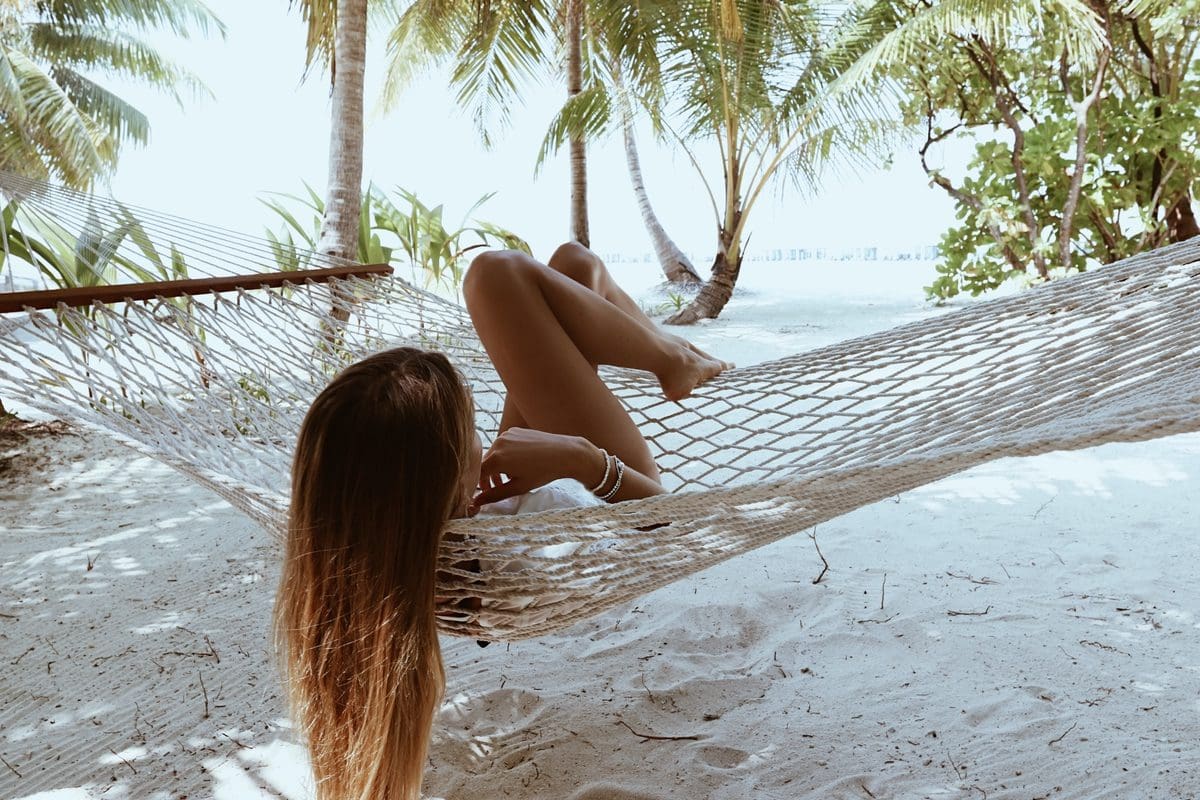 Relaxing in an Amilla Maldives Resort hammock