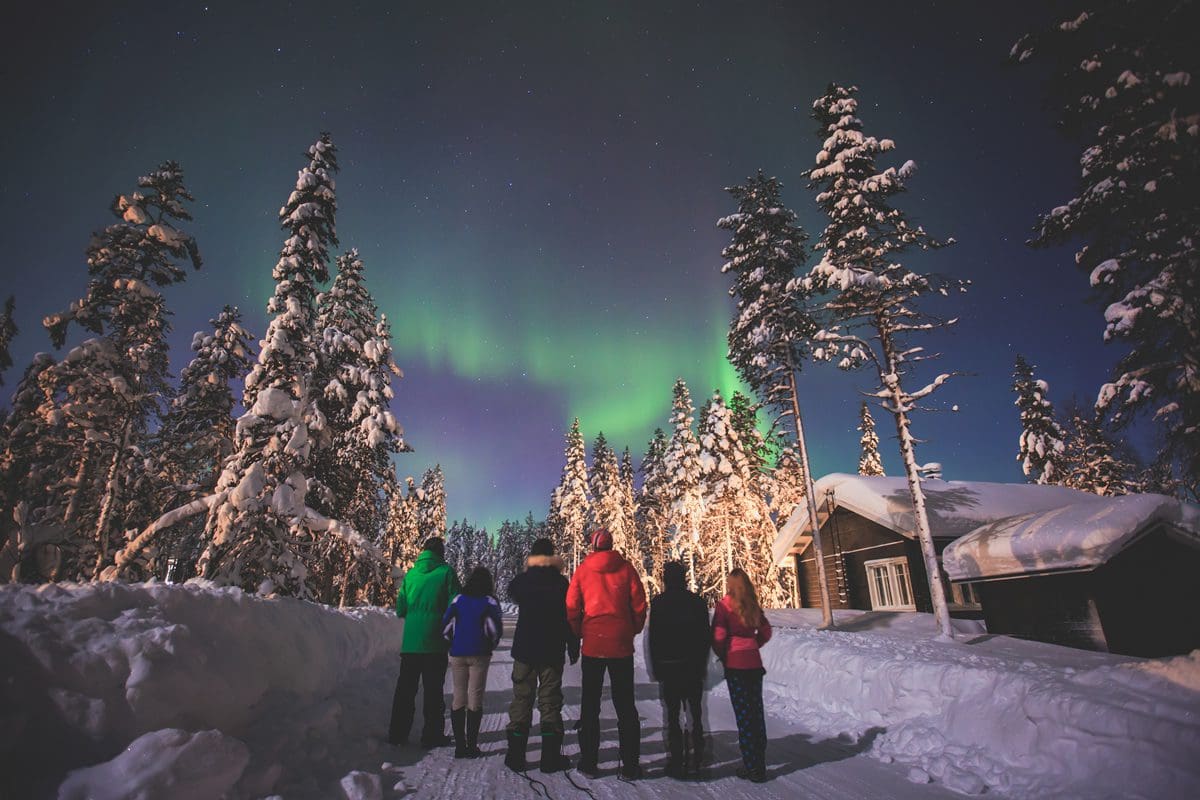Friends gather to witness the Arctic's northern lights