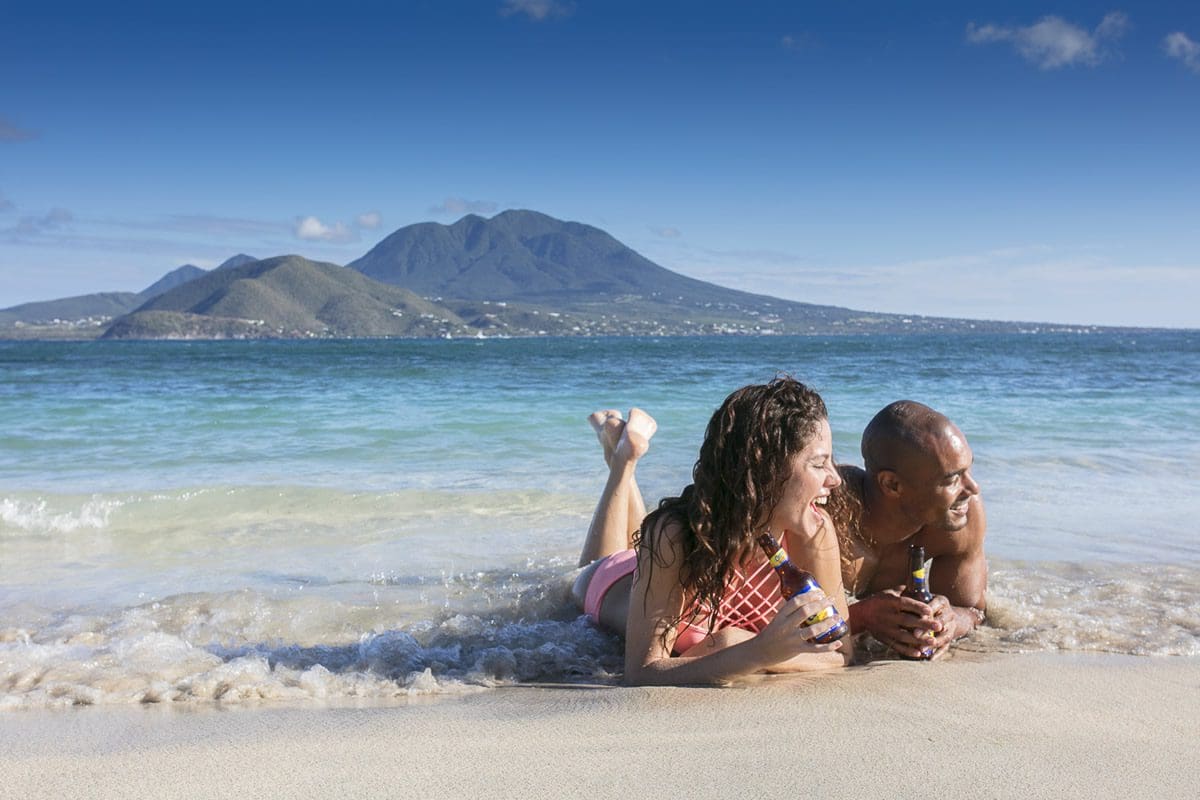 Beach waves couple - St Kitts Tourism