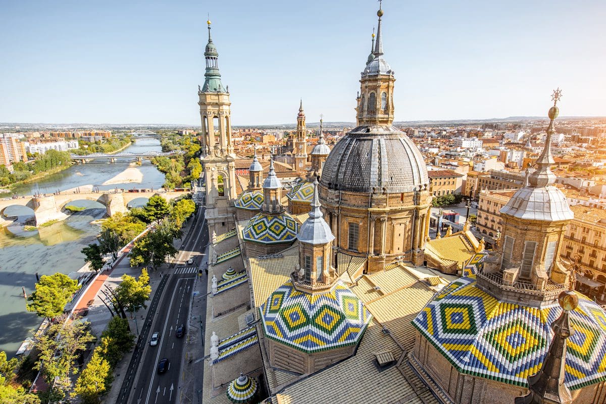 Aerial cityscape view of the rooftops and spires of Basilica Our Lady in Zaragoza, Spain