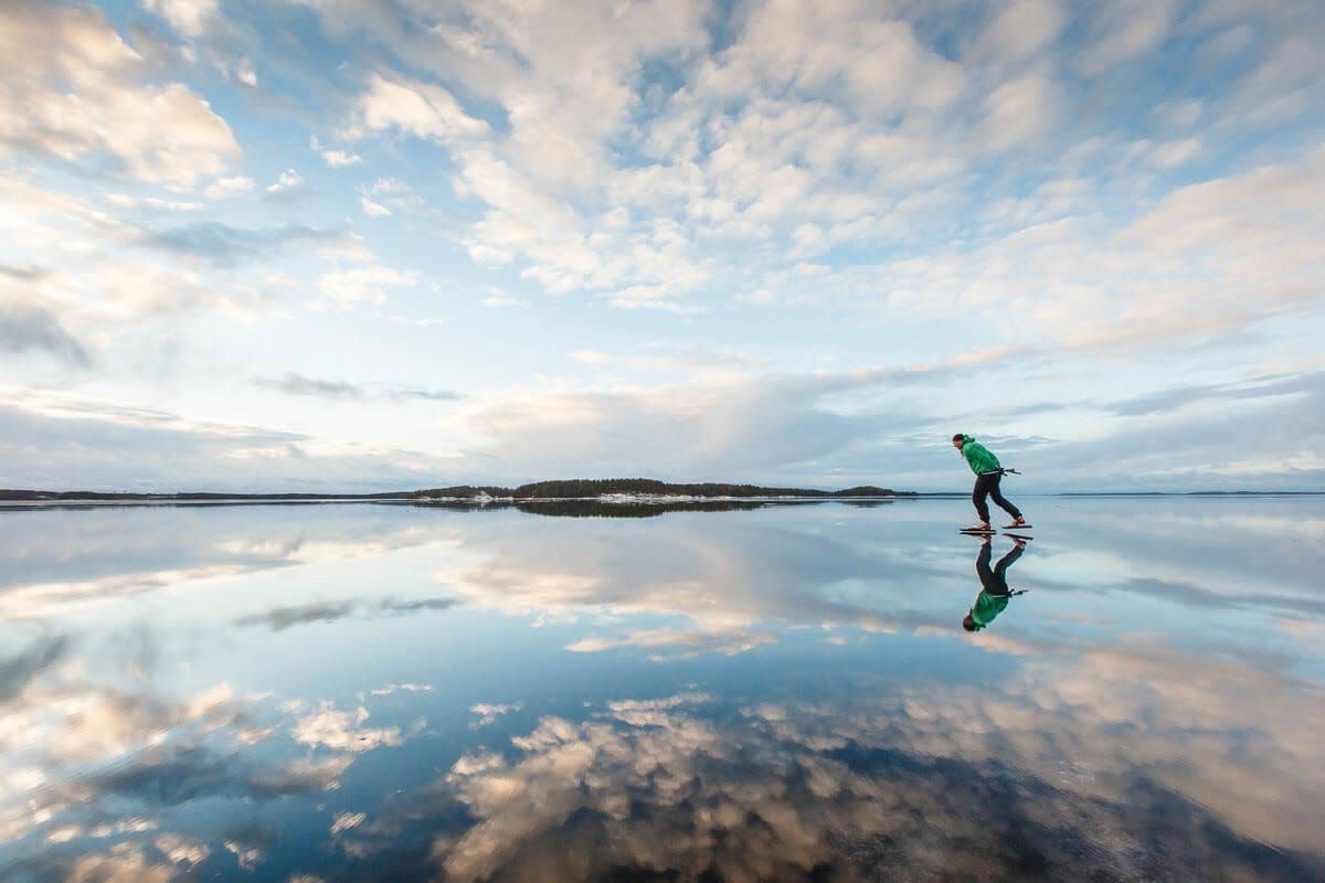 Ice skating on Taipalsaari's Lake Saimaa - Visit Finland/Mikko Nikkinen