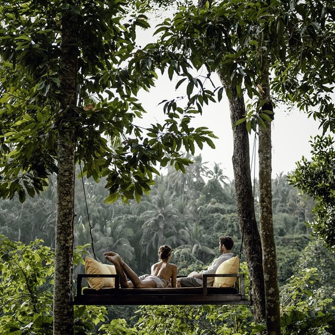 Couple relaxing in the lush landscape of Ubud, Bali - Indonesia Tourism/Fikry Auliya Rahman