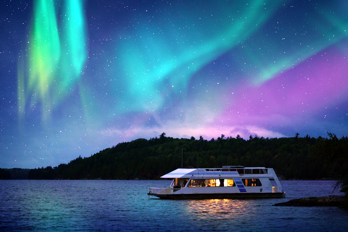 Northern lights with houseboat in Voyageurs National Park - Explore Minnesota