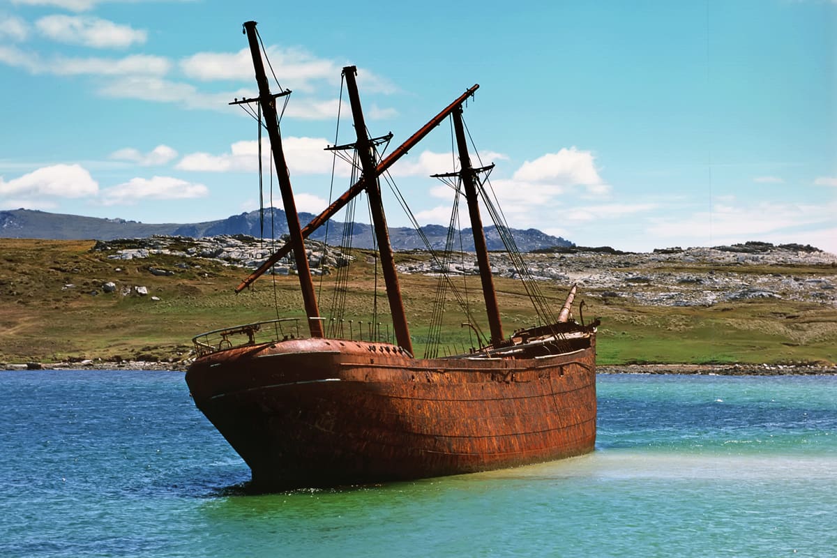 Vintage old ship in a lagoon in the Falkland Islands