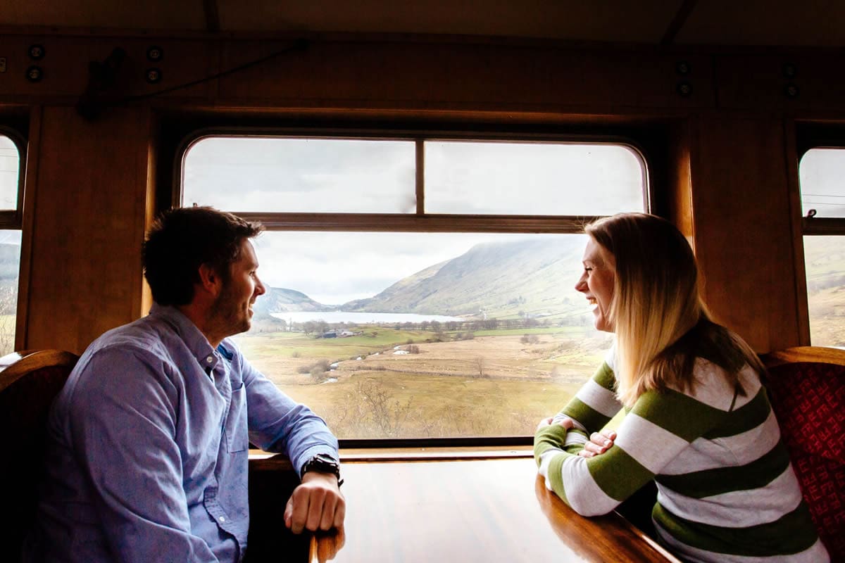 Couple riding the Welsh Highway Railway - VisitBritain/Ben Selway