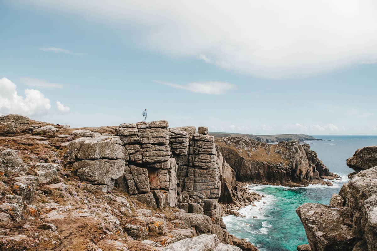 Hiking the headland of Lands End, Cornwall - VisitBritain/@themissmarple
