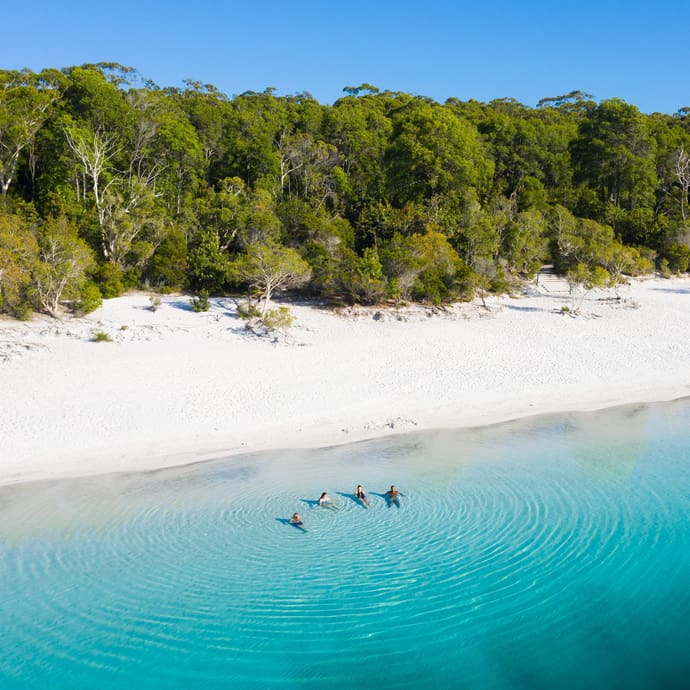 Swimming in Lake McKenzie, Fraser Island/K'Gari - Tourism and Events Queensland/Sean Scott